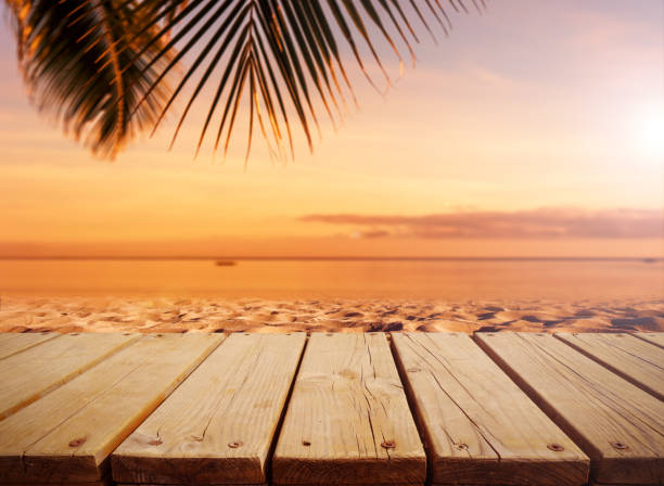 istock Empty wooden table top with tropical ocean sunset background 2187790467