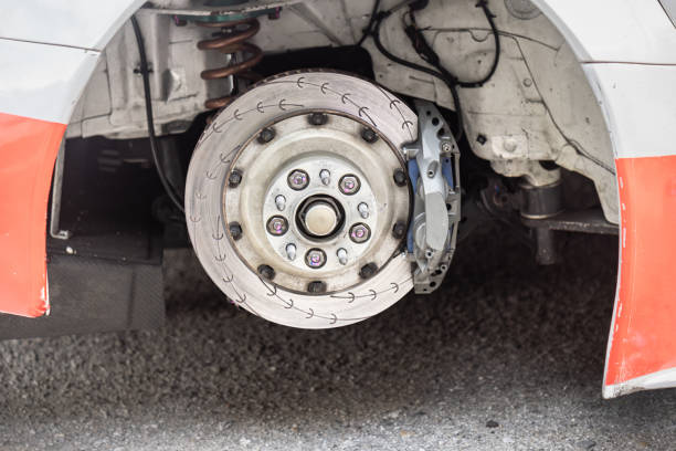 Front car disc brake are repairing in garage.