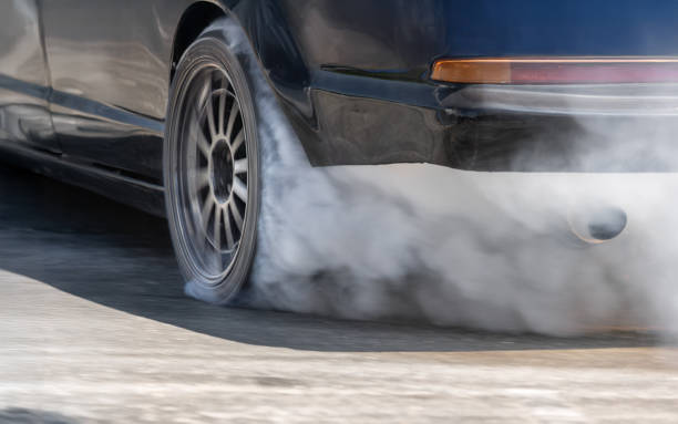 istock Race drift car burning tires on speed track. 2187791455