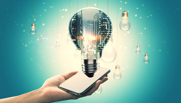 istock Creative concept of innovation with a lightbulb and smartphone on abstract background. 2187792308