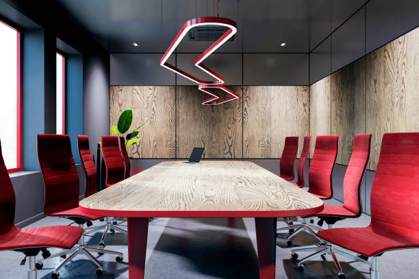 istock Modern boardroom with red chairs and wooden table in a stylish interior. 3D Rendering 2187792637