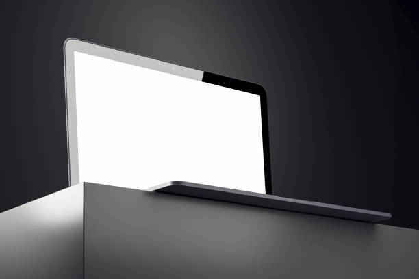 Minimalistic laptop with blank screen on podium in dark studio spotlight background. 3D Rendering