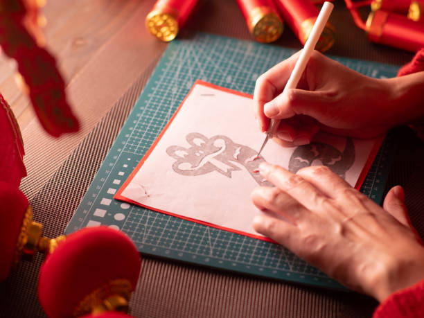 istock Cutting and pasting window decorations during the Spring Festival 2187793204