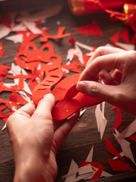 istock Cutting and pasting window decorations during the Spring Festival 2187793513