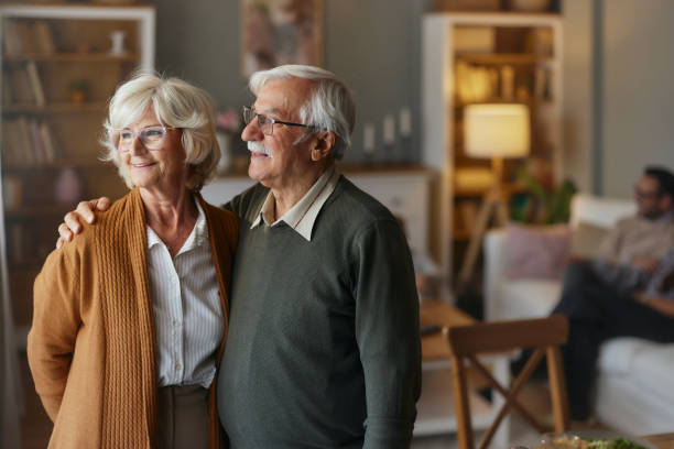 istock Happy senior couple standing embraced at home. 2187794622