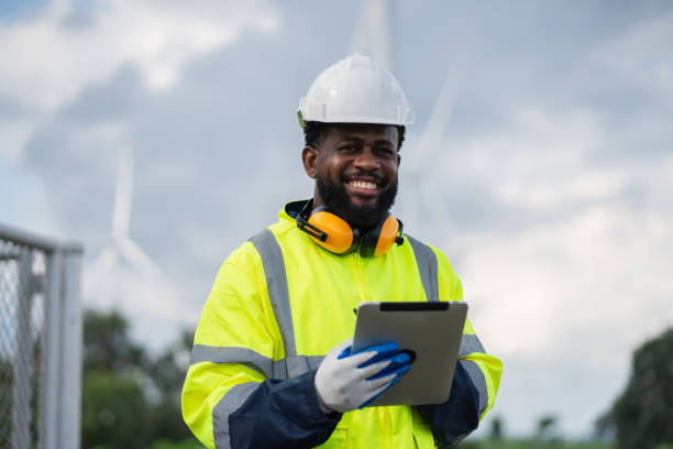 istock Service engineers checking system of windmill. Wind turbines generate electricity. Clean and Renewable energy concept. 2187794977