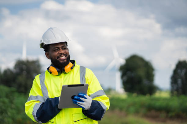 istock Service engineers checking system of windmill. Wind turbines generate electricity. Clean and Renewable energy concept. 2187794985