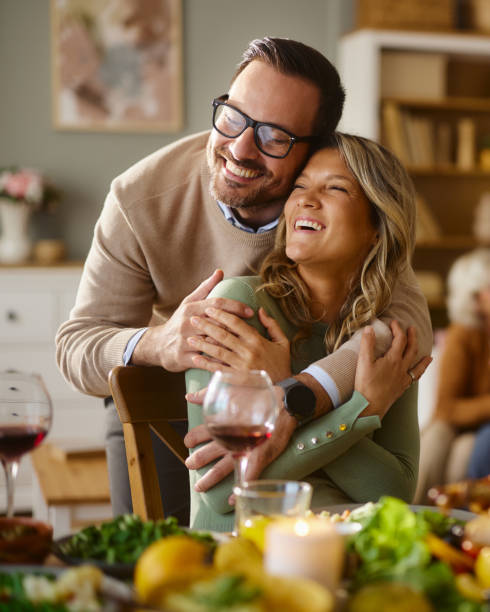 istock Happy couple embracing during lunch in dining room. 2187794989