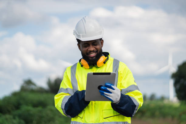 istock Service engineers checking system of windmill. Wind turbines generate electricity. Clean and Renewable energy concept. 2187795034