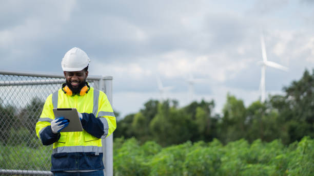 istock Service engineers checking system of windmill. Wind turbines generate electricity. Clean and Renewable energy concept. 2187795047