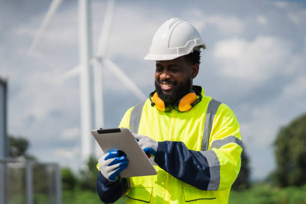 istock Service engineers checking system of windmill. Wind turbines generate electricity. Clean and Renewable energy concept. 2187795064