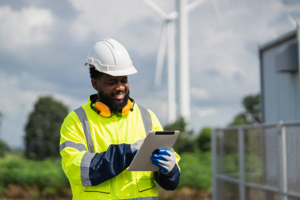 istock Service engineers checking system of windmill. Wind turbines generate electricity. Clean and Renewable energy concept. 2187795087
