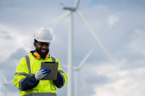 istock Service engineers checking system of windmill. Wind turbines generate electricity. Clean and Renewable energy concept. 2187795119