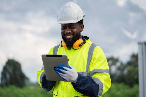 istock Service engineers checking system of windmill. Wind turbines generate electricity. Clean and Renewable energy concept. 2187795128