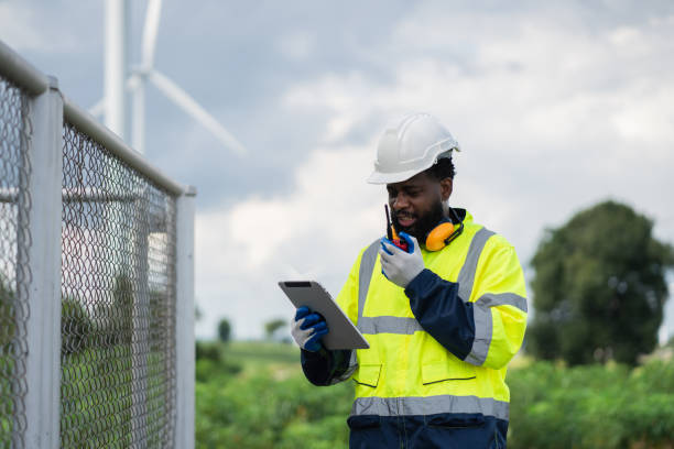 istock Service engineers checking system of windmill. Wind turbines generate electricity. Clean and Renewable energy concept. 2187795152