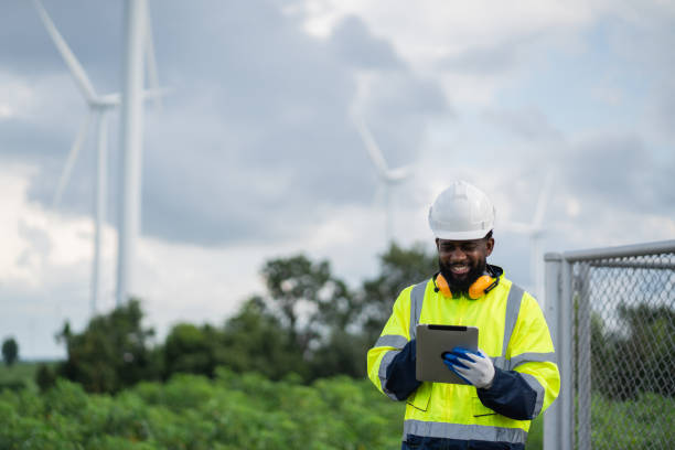 istock Service engineers checking system of windmill. Wind turbines generate electricity. Clean and Renewable energy concept. 2187795180