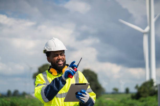 istock Service engineers checking system of windmill. Wind turbines generate electricity. Clean and Renewable energy concept. 2187795191