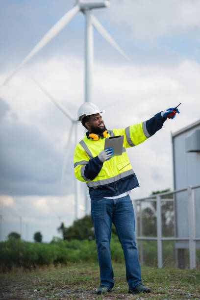 istock Service engineers checking system of windmill. Wind turbines generate electricity. Clean and Renewable energy concept. 2187795224