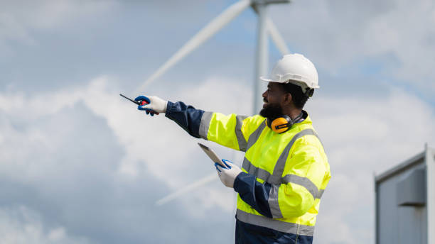 istock Service engineers checking system of windmill. Wind turbines generate electricity. Clean and Renewable energy concept. 2187795230