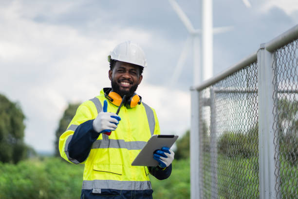 istock Service engineers checking system of windmill. Wind turbines generate electricity. Clean and Renewable energy concept. 2187795246