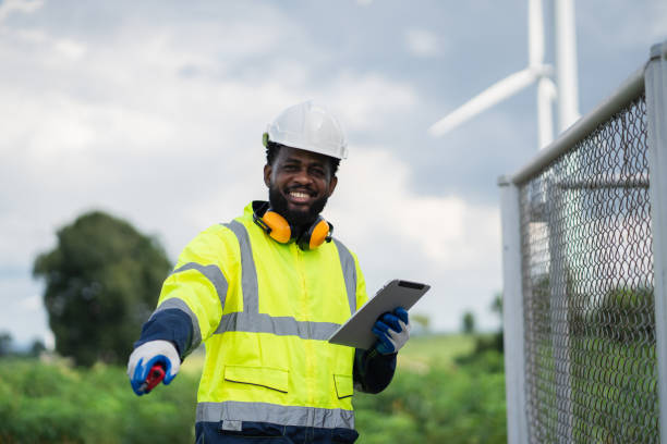 istock Service engineers checking system of windmill. Wind turbines generate electricity. Clean and Renewable energy concept. 2187795310