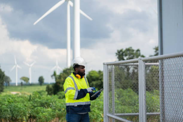 istock Service engineers checking system of windmill. Wind turbines generate electricity. Clean and Renewable energy concept. 2187795323