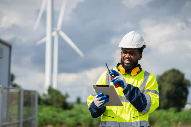 istock Service engineers checking system of windmill. Wind turbines generate electricity. Clean and Renewable energy concept. 2187795416