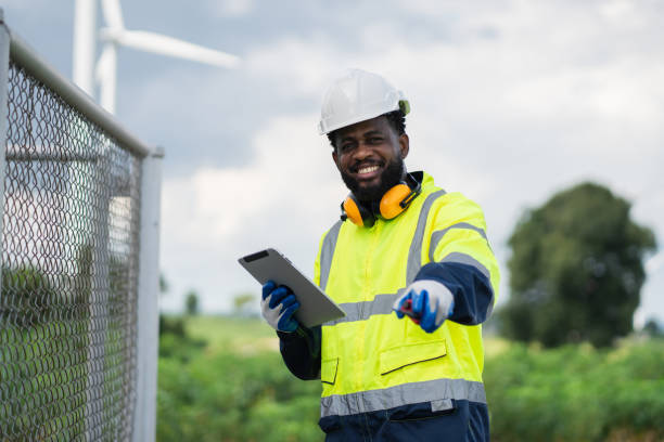 istock Service engineers checking system of windmill. Wind turbines generate electricity. Clean and Renewable energy concept. 2187795527