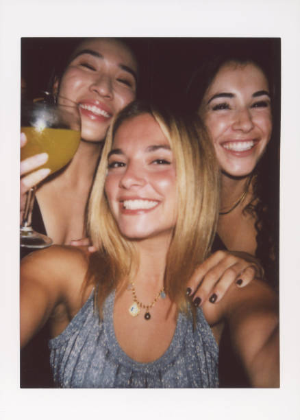 istock Joyful friends enjoying a night out with a selfie. 2187796542