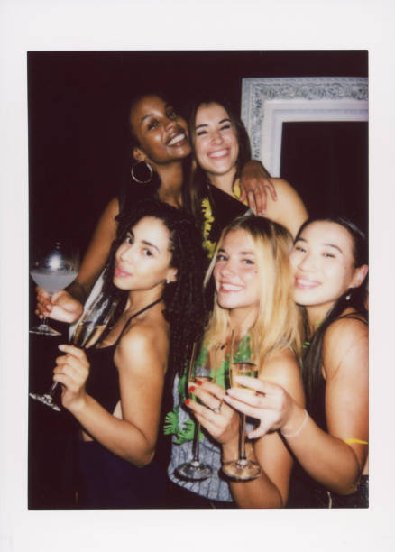 istock Group of friends celebrating with drinks at a festive party 2187796559