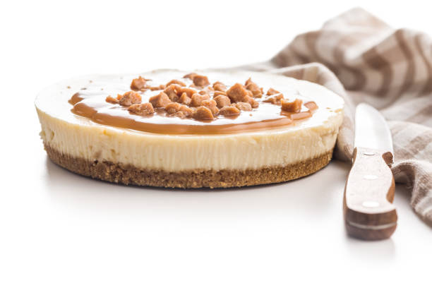istock Cheesecake with caramel topping isolated on white background. 2187796748