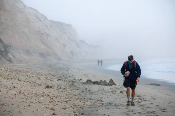 Photographer explores moody coastline, Point Reyes, California