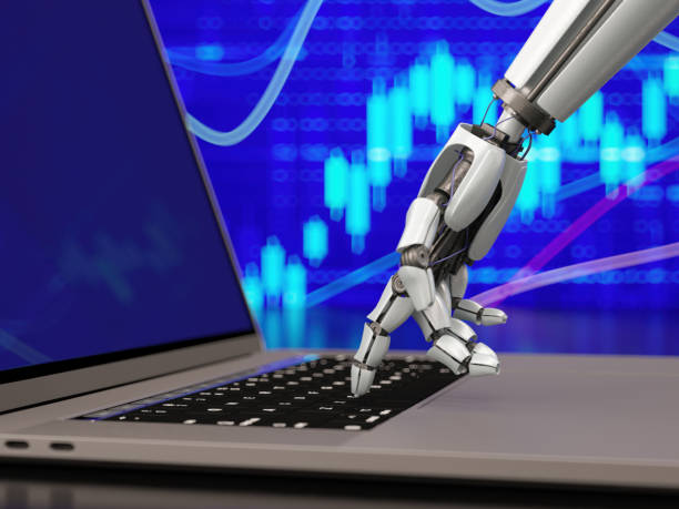istock Artificial Intelligence Trade Concept with an AI Robot's Hand Touching a Laptop Keyboard Against a Financial Chart 2187797036