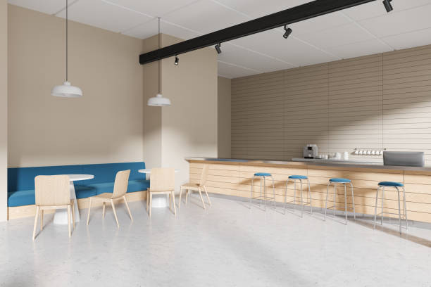 istock Stylish cafeteria interior with bar island and dining table with chairs in row 2187797294
