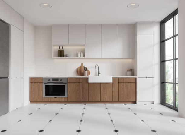 istock White home kitchen interior with cooking shelves, oven and panoramic window 2187798118