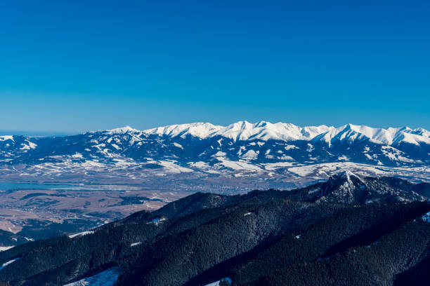 Sina, Liptovska Mara and Western Tatras mountains from Chabenec in winter Low Tatras mountains in Slovakia View to Sina, Liptovska Mara and Western Tatras mountains from Chabenec in winter Low Tatras mountains in Slovakia durkova stock pictures, royalty-free photos & images