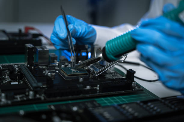 istock killed hands repairing electronic devices with precision. technology repair, technician expertise, and modern electronic maintenance. 2187800559