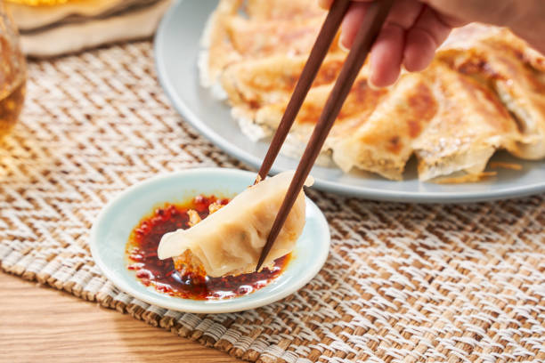 istock Dumplings Commonly Eaten in Japan - Crispy Pan-Fried Gyoza 2187800673