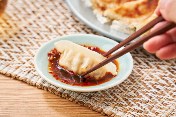 istock Dumplings Commonly Eaten in Japan - Crispy Pan-Fried Gyoza 2187800686
