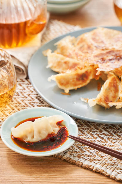 istock Dumplings Commonly Eaten in Japan - Crispy Pan-Fried Gyoza 2187800725