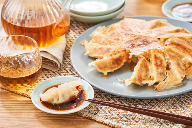 istock Dumplings Commonly Eaten in Japan - Crispy Pan-Fried Gyoza 2187800732