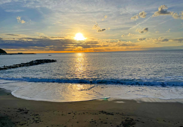 istock Nature and sunset on sea. Clouds and orange sun. 2187803113