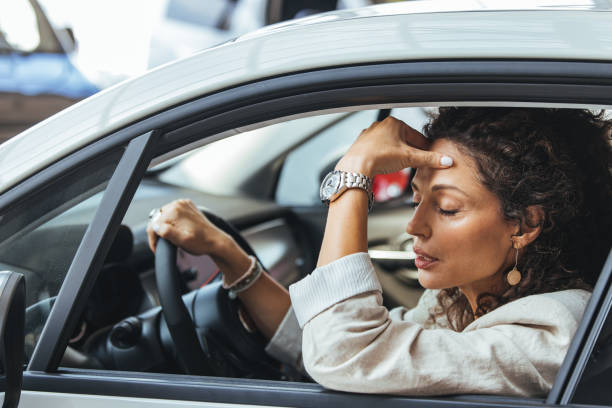istock Stressed Woman Sitting in Car Experiencing Traffic Jam 2187803202