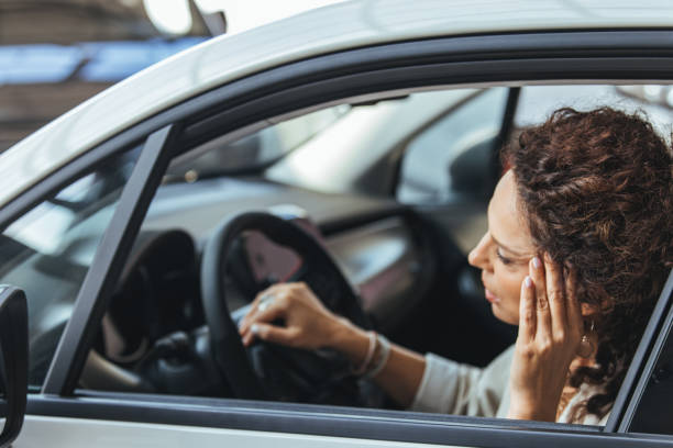 istock Stressed Woman Sitting in Car in Traffic Jam 2187803211