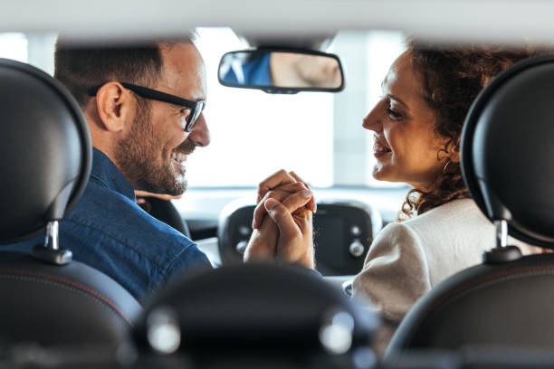 istock Happy Couple Enjoying a Joyful Moment Inside a Car 2187803215