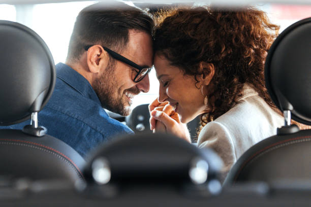 istock Romantic Couple Sharing Tender Moment Inside Car 2187803216