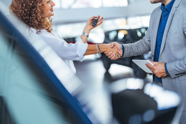 istock Successful Car Deal Handshake Inside Modern Showroom 2187803274