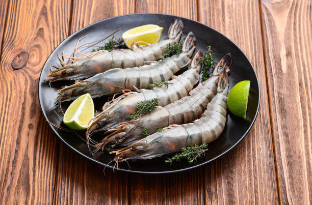 istock Raw big tiger ( king ) shrimps photography . Top view 2187803696