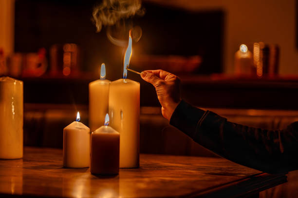 istock Candles lit during a power outage to provide warmth and light in the evening 2187803816