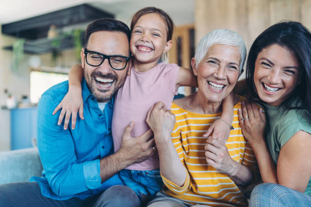 istock Happy three-generations family sitting on the couch 2187804431
